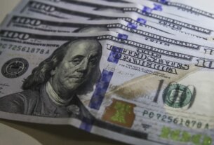 Dólar volta a R$ 5 com ambiente externo e ajuste pós-eleitoral
